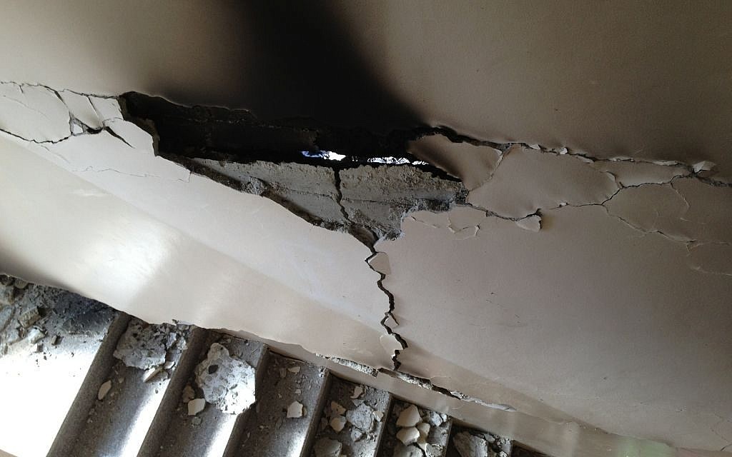 A damaged wall from the IDF detonation of the Qawasmeh home in Hebron, July 1, 2014 (photo credit: Elhanan Miller/Times of Israel)