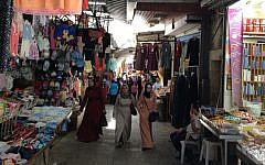 Palestinian women walk through the Old City of Jerusalem, July 13, 2014 (photo credit: Elhanan Miller/Times of Israel)