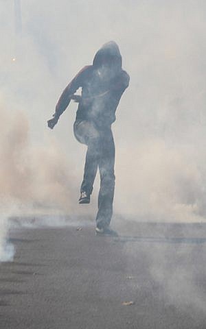 Smoke bombs are set off during the Saturday July 26, 2014 protest in Paris. (Glenn Cloarec/The Times of Israel)