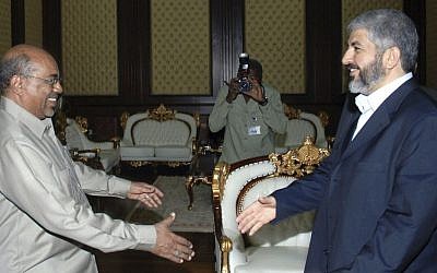 Then-Hamas chief Khaled Mashaal, right, meets with then-Sudanese president Omar Al-Bashir in Khartoum, Sudan, August 2008. (AP/Abd Raouf)