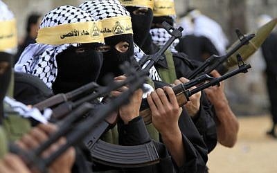Masked Palestinian Fatah fighters from the Al-Aqsa Martyrs Brigades parade during a rally marking the 46th anniversary of the movement's creation, in the Palestinian refugee camp of Ein el-Hilweh, near the southern port city of Sidon, Lebanon, December 31, 2010. (AP Photo/Mohammed Zaatari/File)