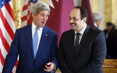 US Secretary of State John Kerry, left, talks with Qatari Foreign Minister Khaled al-Attiyah Saturday, July 26, 2014, at the US ambassador's residence in Paris (photo credit: AP/Charles Dharapak)