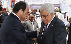 Egyptian President Abdel-Fattah el-Sissi, left, greets Palestinian Authority President Mahmoud Abbas during his inauguration ceremony at the presidential palace in Cairo, Egypt, on June 8, 2014. (AP/MENA)