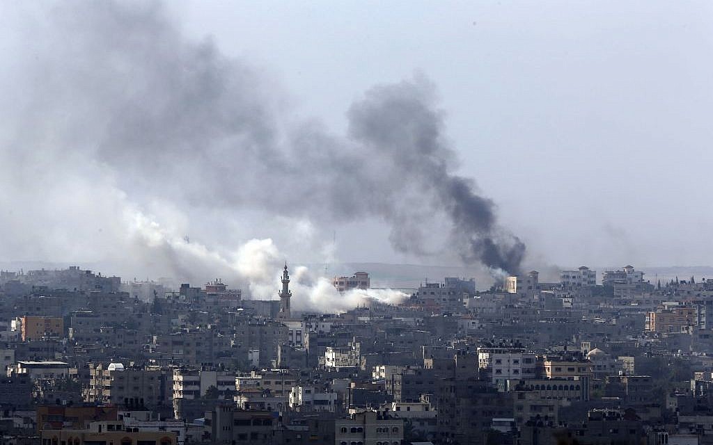 Smoke billows from an area hit by Israeli strikes in Gaza City in the northern Gaza Strip on Sunday, July 20, 2014. (photo credit: AP/Lefteris Pitarakis)