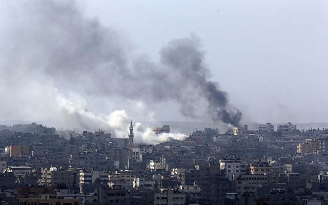 Smoke billows from an area hit by Israeli strikes in Gaza City in the northern Gaza Strip on Sunday, July 20, 2014. (photo credit: AP/Lefteris Pitarakis)