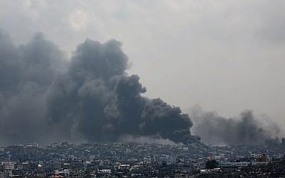 Smoke rises after an Israeli missile hits the Shejaiya neighborhood in Gaza City, northern Gaza Strip, Sunday, July 20, 2014.  (Photo credit: AP/Hatem Moussa)