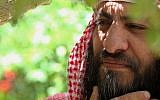 Senior Jordanian Salafi movement leader Mohammed al-Shalabi during an interview with The Associated Press in the backyard of his house in Maan, southwest of Amman, Jordan, Friday, July 4, 2014 (Photo credit: Raad Adayleh/AP)