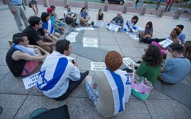 Boston area students gather at Boston University's March Plaza after hearing of the murders of the three kidnapped teens (photo credit: Elan Kawesch)