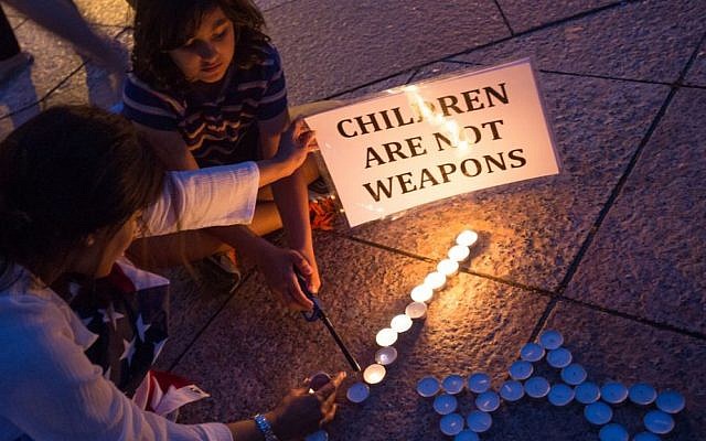 Boston area students hold a candlelight vigil for the three Israeli students who were murdered in the West Bank (photo credit: Elan Kawesch)