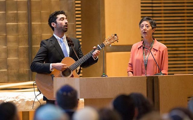 Cantor Jodi Sufrin and Noah Aronson lead a memorial song at Temple Beth Elohim outside Boston last night (photo credit: Elan Kawesch/Times of Israel)