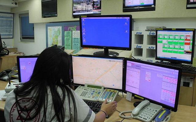 A woman working at Magen David Adoms *101 emergency hotline in Ashdod on Wednesday. (Melanie Lidman/Times of Israel)