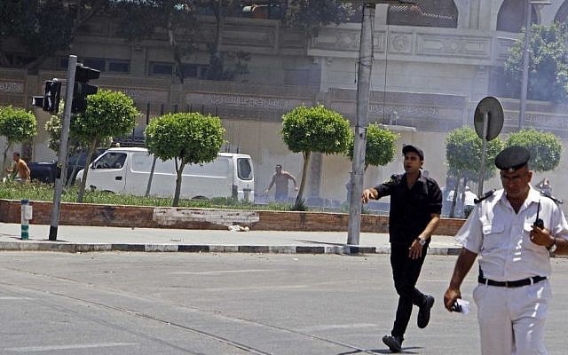 Egyptian security forces inspect the scene after two homemade bombs went off near the presidential palace in Cairo, Egypt, Monday, June 30, 2014 (AP Photo/Ahmed Abdel Fattah, El Shorouk Newspaper) Egyptian security forces inspect the scene after two homemade bombs went off near the presidential palace in Cairo, Egypt, Monday, June 30, 2014 (AP Photo/Ahmed Abdel Fattah, El Shorouk Newspaper)
