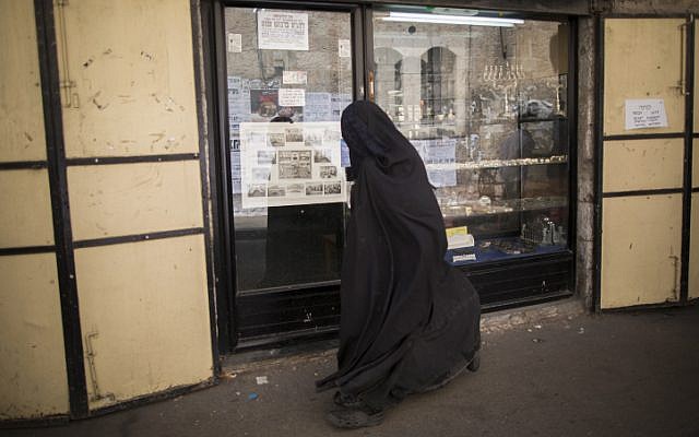 An ultra-Orthodox Jewish woman, covered from head to toe, in the Mea Shearim neighborhood of Jerusalem (illustrative photo: Yonatan Sindel/Flash 90)