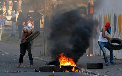 Palestinians clash with Israeli border police during clashes in Wadi Ara, northern Israel , July 5, 2014. (photo credit: Izik Barbi/Flash90)