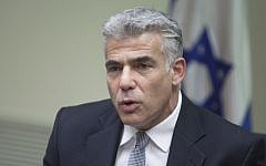 Finance Minister Yair Lapid, speaks during a meeting of his Yesh Atid faction  at the Knesset, on June 30, 2014. (photo credit: Flash90)