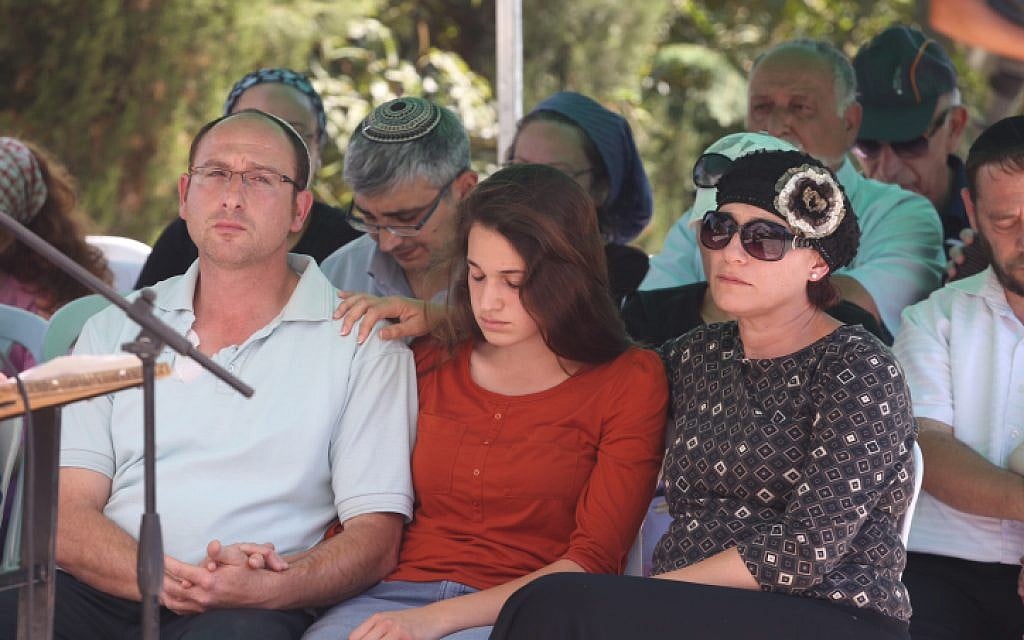 Ofir (L) and Bat Galim (R) Sha'ar, parents of the late Gil-ad Sha'ar, at the funeral procession ceremony on July 1, 2014 (photo credit: Flash90) Ofir (L) and Bat Galim (R) Sha'ar, parents of the late Gil-ad Sha'ar, at the funeral procession ceremony on July 1, 2014 (photo credit: Flash90)