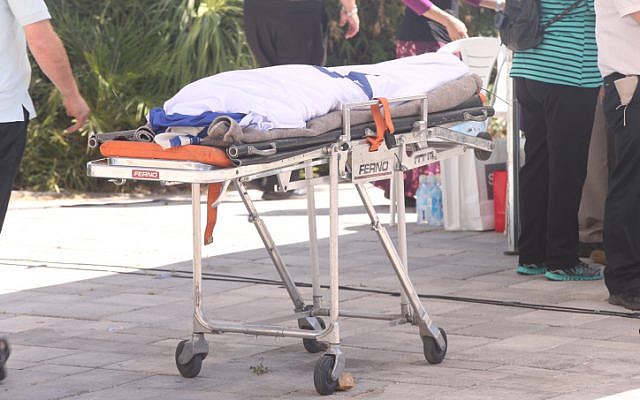 The body of Gil-ad Sha'ar, 16, wrapped in the Israeli flag, is led at a funeral procession ceremony held in his family's hometown of Talmon, on July 1, 2014. (photo credit: Flash90)