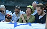 Rachelle Fraenkel crying over the body of her son Naftali at his funeral, July 2014 (photo credit: Flash90)