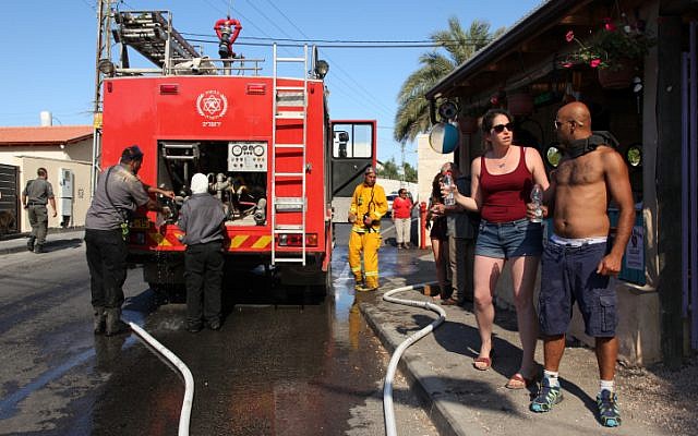 Firefighters evacuate residents in Jerusalem, July 2, 2014. (photo credit: Flash90)
