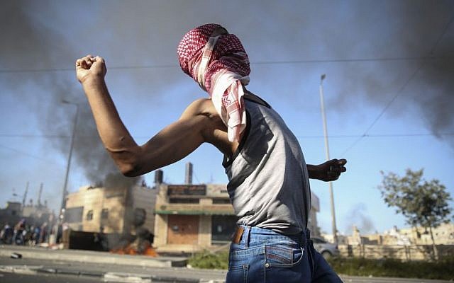 Palestinians clash with Israeli border police in the East Jerusalem neighborhood of Shuafat after the body of a Palestinian teen from East Jerusalem is found in the Jerusalem Forest, Wednesday, July 2, 2014. (photo credit: Hadas Parush/Flash90) Palestinians clash with Israeli border police in the East Jerusalem neighborhood of Shuafat after the body of a Palestinian teen from East Jerusalem is found in the Jerusalem Forest, Wednesday, July 2, 2014. (photo credit: Hadas Parush/Flash90)