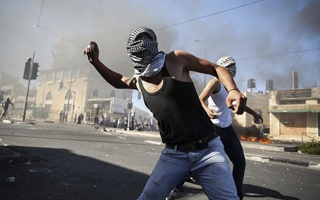 Palestinians clash with Israeli border police in the East Jerusalem neighborhood of Shuafat after the body of a Palestinian teen from East Jerusalem is found in the Jerusalem Forest, Wednesday, July 2, 2014. (photo credit: Hadas Parush/Flash90)