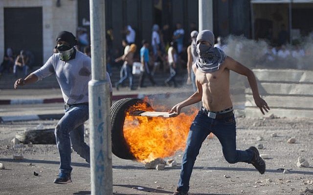 Palestinians clash with Israeli border police during the funeral of 16-year-old Palestinian teenager Mohamed Abu Khdeir in the Arab neighborhood of Shuafat, East Jerusalem on July 04, 2014. (Photo credit: Yonatan Sindel/Flash90) Palestinians clash with Israeli border police during the funeral of 16-year-old Palestinian teenager Mohamed Abu Khdeir in the Arab neighborhood of Shuafat, East Jerusalem on July 04, 2014. (Photo credit: Yonatan Sindel/Flash90)