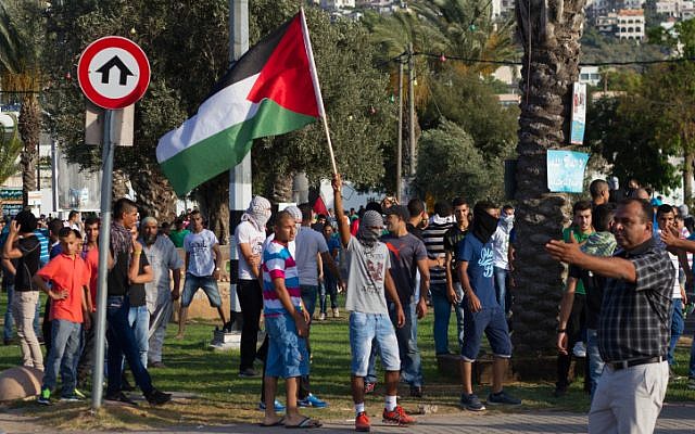 Residents of the Arab town of Arara, in northern Israel, protest on July 5, 2014 (photo credit: Omar Samir/FLASH90) Residents of the Arab town of Arara, in northern Israel, protest on July 5, 2014 (photo credit: Omar Samir/FLASH90)