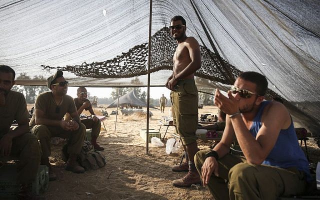 IDF soldiers seen in a tent in a field, near the Gaza border in Southern Israel, on Sunday, July 6, 2014 (photo credit: photo credit: Hadas Parush/Flash90) IDF soldiers seen in a tent in a field, near the Gaza border in Southern Israel, on Sunday, July 6, 2014 (photo credit: photo credit: Hadas Parush/Flash90)