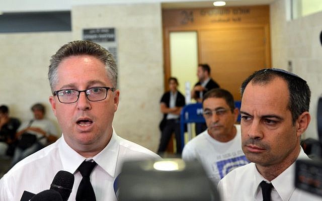 Uri Keinan (L) and Adi Keidar, lawyers for some of the six suspects held in the murder of an Arab teenager, speak outside a courtroom in Petah Tikva, Sunday, July 6, 2014. The court remanded six Jewish suspects in the killing last week of Muhammed Abu Khdeir, 16. (Photo credit: Flash90)