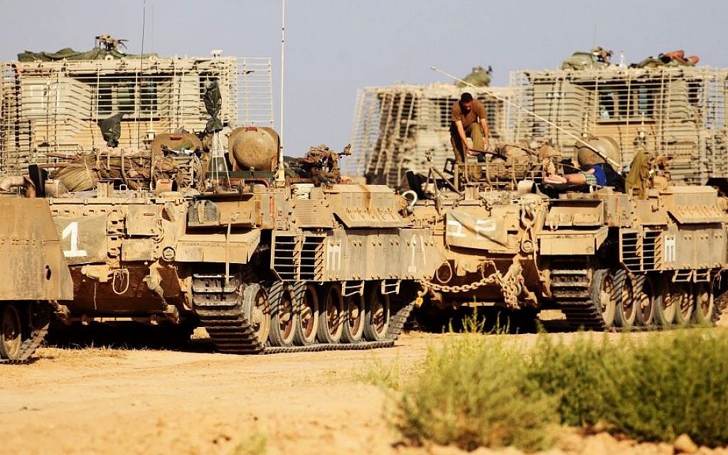 IDF APCs (Armed Personnel Carriers) near the Gaza border on the first day of Operation Protective Edge, July 8, 2014. (Photo credit: David Buimovitch/Flash90) IDF APCs (Armed Personnel Carriers) near the Gaza border on the first day of Operation Protective Edge, July 8, 2014. (Photo credit: David Buimovitch/Flash90)