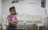 A young Israeli girl is seen in a bomb shelter of an apartment building in Ashkelon, southern Israel, on the third day of Operation Protective Edge, Thursday, July 10, 2014. Over 360 rockets were fired from Gaza into Israel over the past three days. (photo credit: Hadas Parush/Flash90)