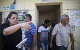 Israelis come out of a shelter in Sderot after a rocket attack on July 10, 2014. Illustrative photo (photo credit: Hadas Parush/Flash90)