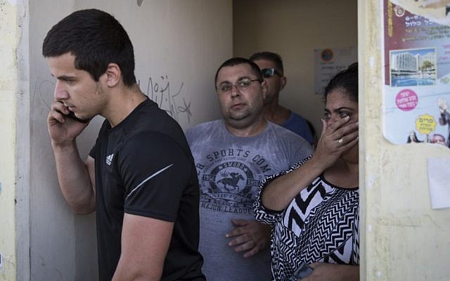Israelis take cover in a street shelter as the Code Red alert sounds in Sderot, southern Israel, on the third day of Operation Protective Edge, Thursday July 10, 2014. (photo credit: Hadas Parush/Flash90)