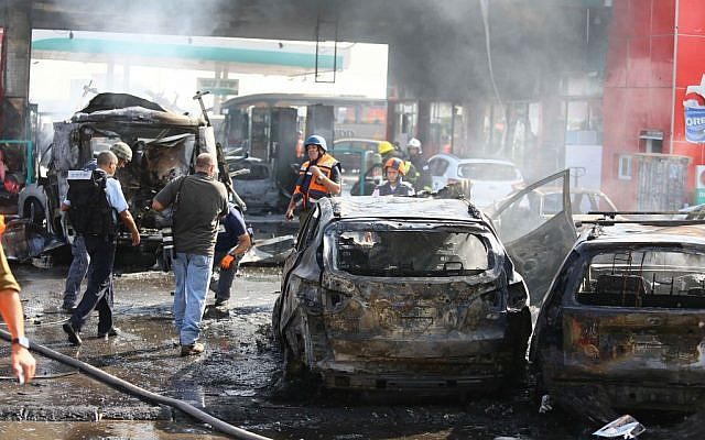 Fire Fighters at the scene of a gas station in Ashdod that was hit directly by rocket fire from Gaza on the fourth day of Operation Protective Edge, July 11, 2014.  (Photo credit: Flash90)