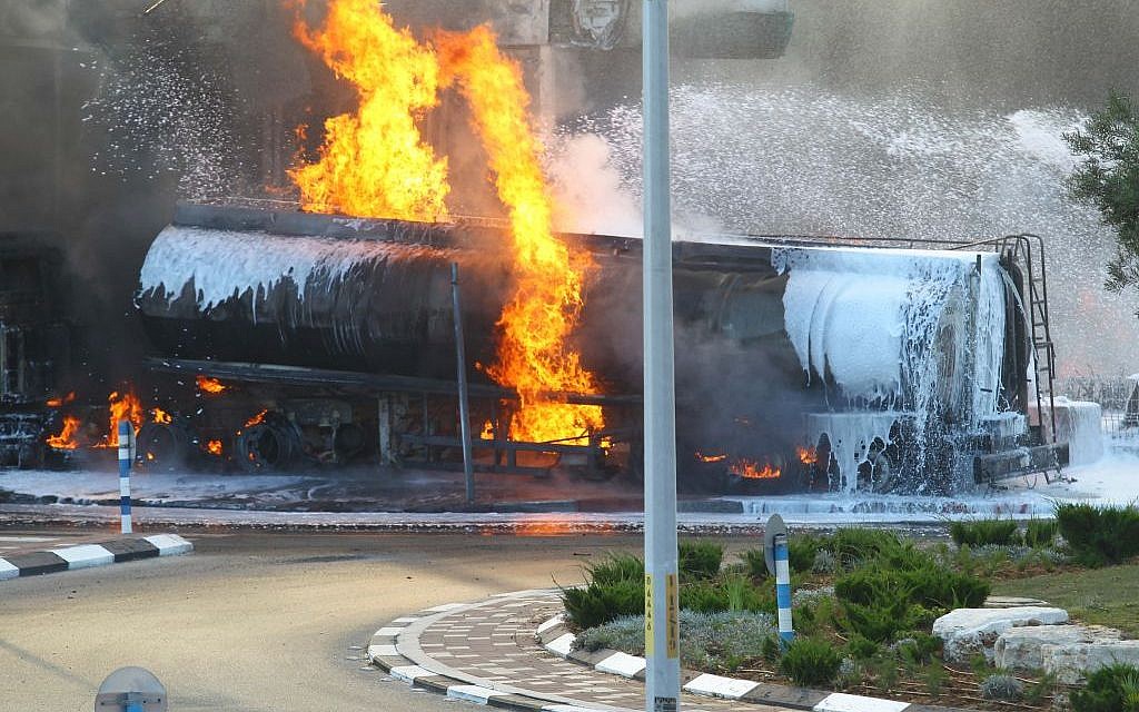 Flames rise at a gas station in Ashdod that was hit directly by rocket fire from Gaza on the fourth day of Operation Protective Edge, July 11, 2014. The rocket caused explosions and three people were injured, one of them critically. (Photo credit: Flash90)