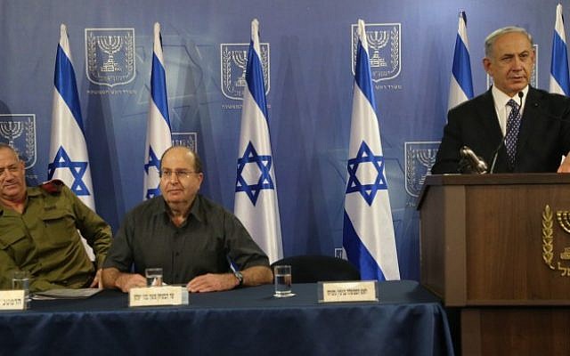 Prime Minister Benjamin Netanyahu (right), Defense Minister Moshe Ya'alon and IDF Chief of Staff Benny Gantz(left) seen at a press conference at the ministry of Defense, in Tel Aviv, July 15, 2014. (Photo credit: Flash90) Prime Minister Benjamin Netanyahu (right), Defense Minister Moshe Ya'alon and IDF Chief of Staff Benny Gantz(left) seen at a press conference at the ministry of Defense, in Tel Aviv, July 15, 2014. (Photo credit: Flash90)