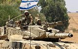 A tank along the Gaza-Israeli border on July 18 (photo credit: Edi Israel/Flash90)