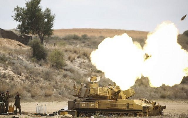 IDF Artillery Corps seen firing shells to Gaza, near the border in Southern Israel on July 18, 2014, after Israeli forces began a ground invasion in an escalation of the operation as it entered its 11th day. (Photo credit: Hadas Parush/Flash90) IDF Artillery Corps seen firing shells to Gaza, near the border in Southern Israel on July 18, 2014, after Israeli forces began a ground invasion in an escalation of the operation as it entered its 11th day. (Photo credit: Hadas Parush/Flash90)