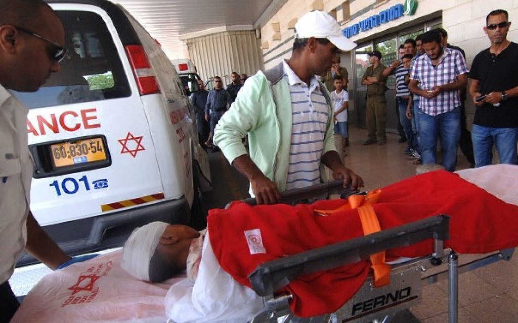 A Bedouin child is brought to the emergency room at Soroka hospital in Beersheba, after his family home, a shed in an unrecognized Bedouin village near Dimona, was hit by a rocket fired from Gaza, on July 19, 2014. (Dudu Greenspan/ Flash90/ File)