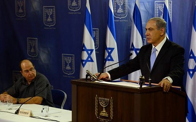 Prime Minister Benjamin Netanyahu speaks at a press conference at the Ministry of Defense in Tel Aviv on July 20, 2014. Defense Minister Moshe Ya'alon looks on. (Photo credit: Haim Zach / GPO/FLASH90) Prime Minister Benjamin Netanyahu speaks at a press conference at the Ministry of Defense in Tel Aviv on July 20, 2014. Defense Minister Moshe Ya'alon looks on. (Photo credit: Haim Zach / GPO/FLASH90)