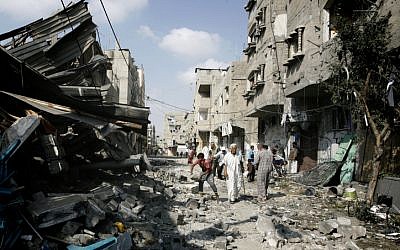 Palestinians inspect the destruction of Farouq Mosque after it was hit in an Israeli airstrike, in Rafah, southern Gaza Strip, on July 22, 2014. (photo credit: Abed Rahim Khatib/Flash90)