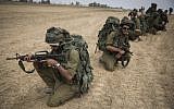 Illustrative photo of IDF soldiers conducting training in a field near the border with Gaza in southern Israel, on July 22, 2014. (Hadas Parush/Flash90)