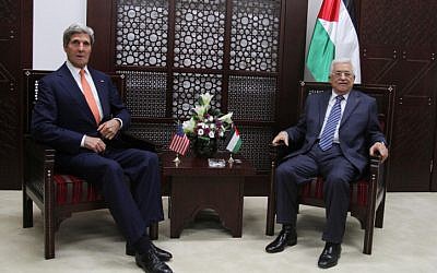 US Secretary of State John Kerry (left) speaks with Palestinian Authority President Mahmoud Abbas (right), on Wednesday, July 23, 2014. (photo credit: Issam Rimawi/Flash90)