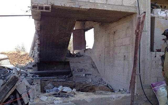 A tunnel, within a civilian home, found by Golani soldiers in the northern Gaza Strip, July 2014 (photo credit: IDF Spokesperson's Unit/ Flash 90) A tunnel, within a civilian home, found by Golani soldiers in the northern Gaza Strip, July 2014 (photo credit: IDF Spokesperson's Unit/ Flash 90)