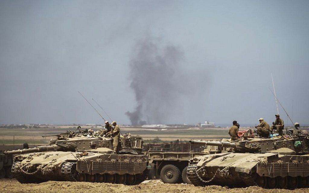 Israeli Air Force bombings in the Gaza Strip can be seen from an IDF deployment in a field near the Israeli border with Gaza on July 25, 2014. (photo credit: Hadas Parush/Flash90) Israeli Air Force bombings in the Gaza Strip can be seen from an IDF deployment in a field near the Israeli border with Gaza on July 25, 2014. (photo credit: Hadas Parush/Flash90)