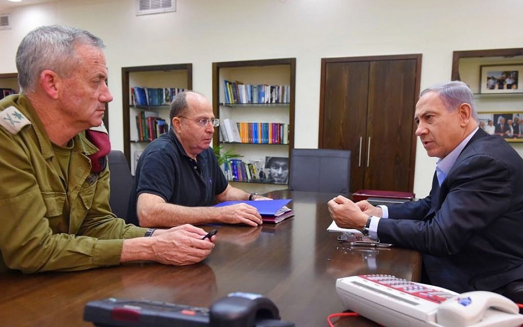 Prime Minister Benjamin Netanyahu (R), Defense Minister Moshe Ya'alon (C), and IDF Chief of Staff, Benny Gantz seen during a meeting at the Kirya military headquarters in Tel Aviv on July 26, 2014. (Photo credit: Ariel Hermoni/Ministry of Defense/Flash90)