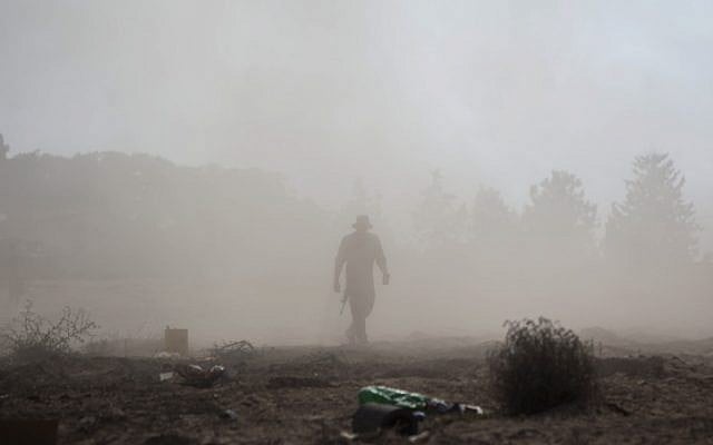 An Israeli soldier at a deployment area near the border with the Gaza Strip, on July 28, 2014. (photo credit:  Yonatan Sindel/Flash90)