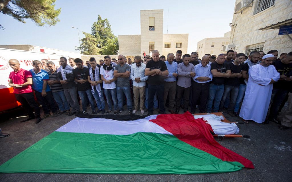 Palestinians mourn Zehir Al-Najar, 7, and Ahmed Abu Baler, 19, from the Gaza Strip, at their funeral in East Jerusalem July 30, after they died from injuries sustained following an Israeli military strike in Khan Yunis, Gaza Strip (photo credit: Sliman Khader/FLASH90)
