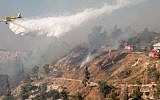 Israeli firefighter airplanes try to extinguish a large fire raging in the hills outside Jerusalem, causing residents in the area to evacuate their homes, on July 2, 2014. (photo credit: Flash90)