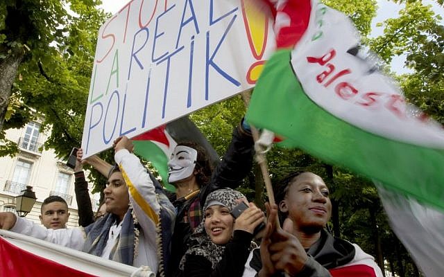 Palestinian youth protest in Paris Friday, July 11, 2014. (Photo credit: AP/Jacques Brinon) Palestinian youth protest in Paris Friday, July 11, 2014. (Photo credit: AP/Jacques Brinon)